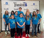 BSBP students standing in front of Transition Services banner