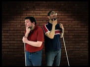 Two men holding canes and wearing pensive expressions