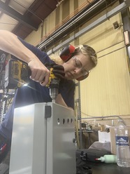 Holly working on an electronic control