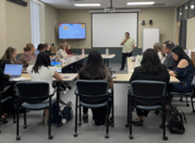 From back view of a people sitting for a presentation