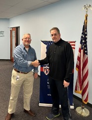 Tony Hoffman shaking hands with VES staff