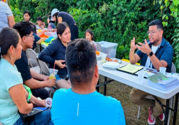 Photo of AFLS staff conducting farmworker outreach