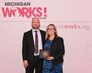 Ryan Hundt and Stephanie Beckhorn holding Workforce Champion Award