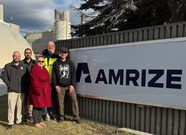 Brandon Latusek, Pat Muoio, Brandy Kozlowski, Jeff Scott and US Army Veteran Ken Richardson standing next to Amrize sign