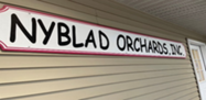 Picture of NYBLAD Orchards business sign.