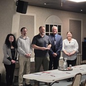 Employer champions giving award to Guide Star representatives