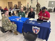 Unnamed veteran client, Jason Rogers (MVAA) in a green jacket, Joe Saur (MVAA) and Keiven Colbert (VES)