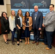 SEMCA, Henry Ford and LEO staff in front of Race to Talent banner