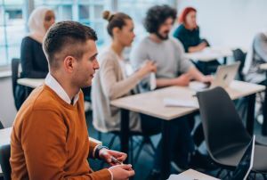 Group of business colleagues sitting at desks