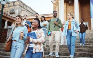 Group of college students walking down school steps