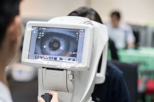 Close up of eye on vision exam machine
