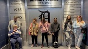Group of students standing in front of the old English D at Tigers Stadium