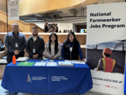 NFJP team standing behind AFLS table