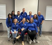 AES team wearing matching blue shirts