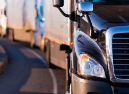 Close up of front of large truck on the road