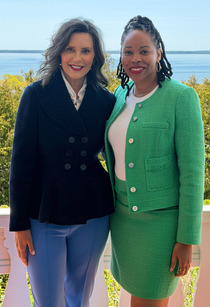 Photo of Justine Johnson with Governor Gretchen Whitmer on porch of the Grand Hotel at Mackinac Policy Conference