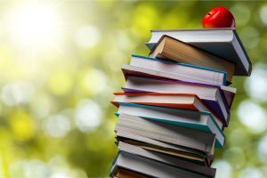 Stack of books with an apple on top