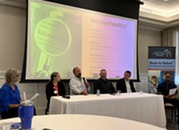 People sitting at a panelist table during Race to Talent event