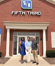 From left: Octavia Crum, Jawana White and David Seymour outside Fifth Third bank