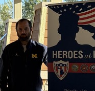 Cody Goodburn standing next to a VES banner