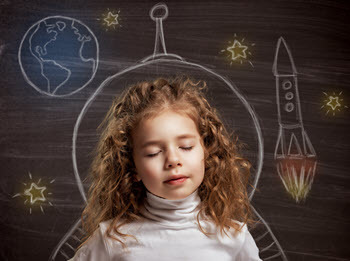 Little girl imaging space travel