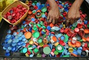 hands sorting plastic to recycle
