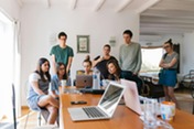 students around a computer