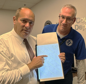Clerk Forlini and Michael Grix with watermarked ballot
