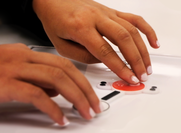 Hands using buttons 