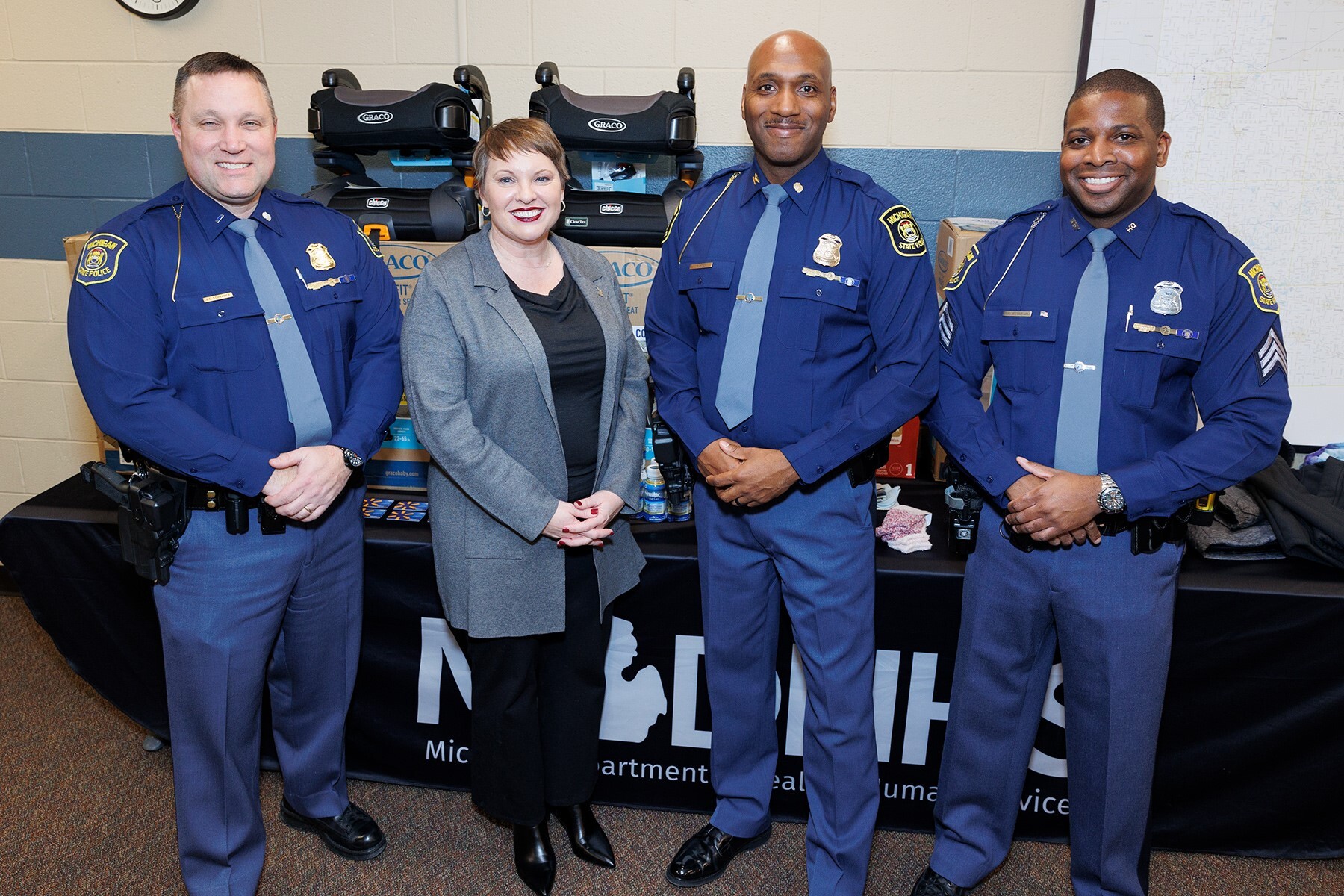 MSP Inspector Barry Schrader pictured with MDHHS Director Elizabeth Hertel and MSP Colonel James F. Grady II and Sgt. Ronnie Evans