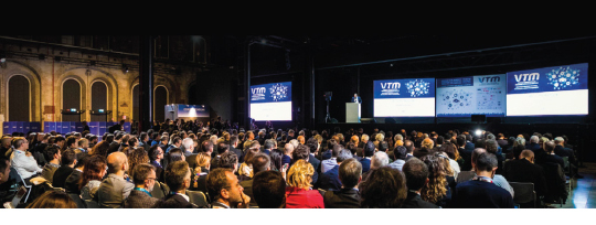 Auditorium full of people watching a VTM Presentation