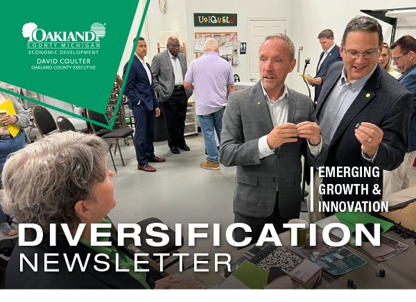 Oakland County Emerging Growth & Innovation Diversification Newsletter - Photo Dave Coulter visiting a booth at the Project Diamond Phase 2 Launch