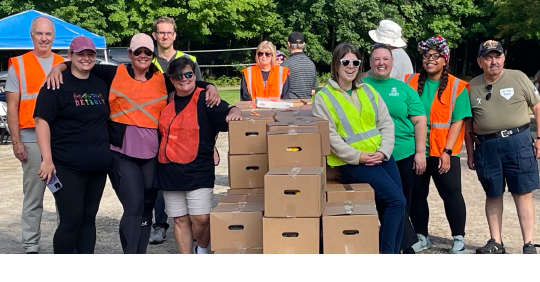 Volunteers with food boxes at a Veterans food distribution event