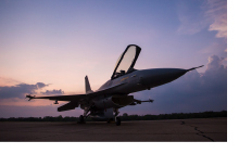 Jet silhouetted against a dusk sky.