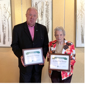 James J. Simone and JoAnn Van Tassel holding their service award plaques