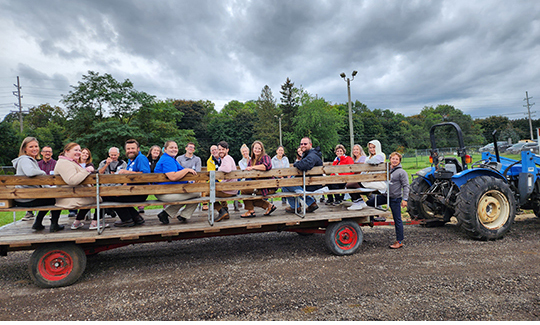 Happy group taking a hayride