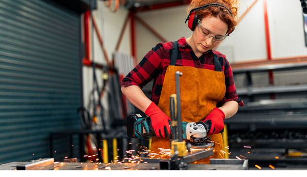 Woman using an angle grinder