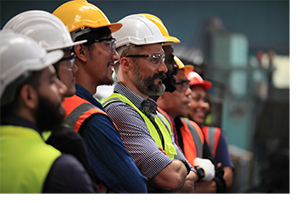 Manufacturing workers standing in a line