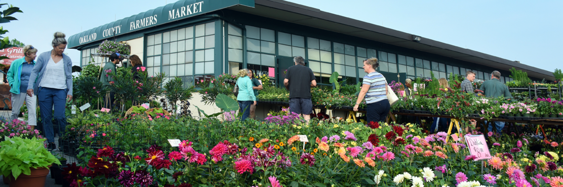 guests shopping for flowers at the farmers market