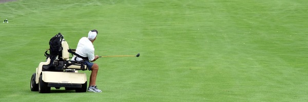 golfer with adaptive golf cart on the golf course