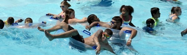 guests swimming in the wave pool