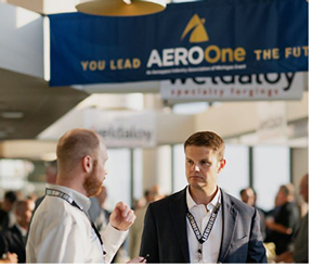 Attendees networking at AeroOne Conference.