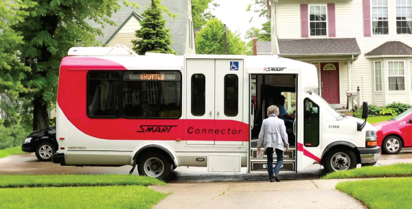 Woman boarding a smart bus.