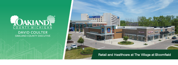 Header: Oakland County Logo | Photo of Retail and Healthcare buildings at The Village at Bloomfield
