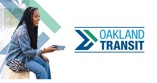 Woman at the bus stop holding her phone | Oakland Transit Logo