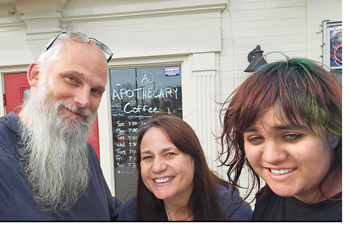 Family taking a selfie at Apothecary Coffee Shop