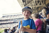 Smiling child at baseball game