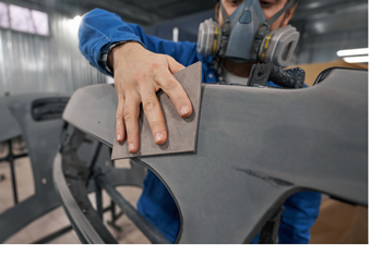 Person working on a vehicle part