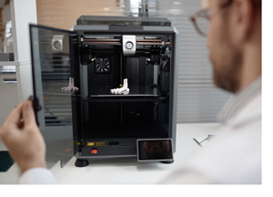 Man working with a 3D printer