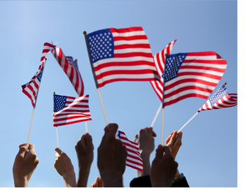 Hands holding an American Flag